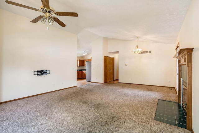 4977 Softwood Ct, Westerville, OH 43081 - unfurnished living room featuring light colored carpet, a ceiling fan, baseboards, a tile fireplace, and high vaulted ceiling