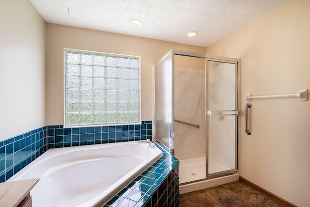 4977 Softwood Ct, Westerville, OH 43081 - full bath with a bath, a shower stall, a textured ceiling, and recessed lighting