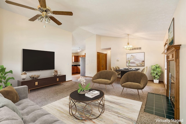 4977 Softwood Ct, Westerville, OH 43081 - living room featuring light carpet, lofted ceiling, a ceiling fan, and a chandelier