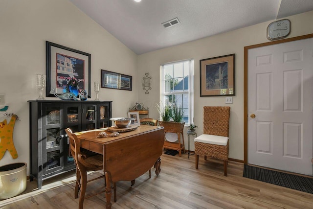 1324 Hillview Cir W, Newark, OH 43055 - home office featuring baseboards, vaulted ceiling, light wood-style flooring, and visible vents