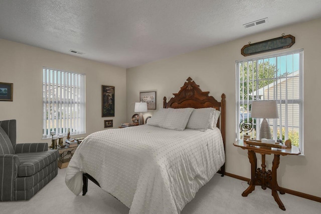 1324 Hillview Cir W, Newark, OH 43055 - bedroom with baseboards, carpet, a textured ceiling, and visible vents