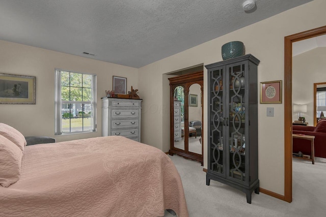 1324 Hillview Cir W, Newark, OH 43055 - bedroom featuring visible vents, light carpet, baseboards, access to outside, and a textured ceiling