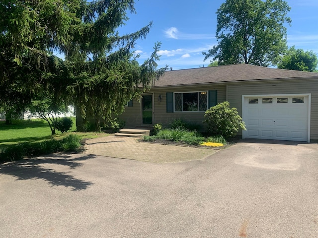109 Williams Rd, Columbus, OH 43207 - ranch-style house with driveway and an attached garage