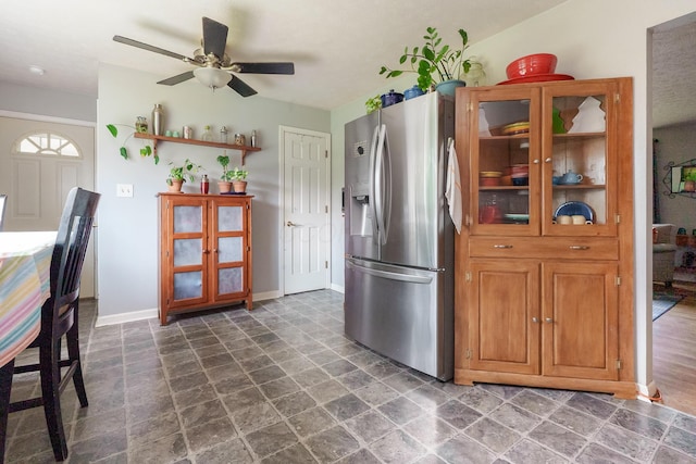 109 Williams Rd, Columbus, OH 43207 - kitchen featuring stainless steel fridge with ice dispenser, brown cabinetry, a ceiling fan, baseboards, and open shelves