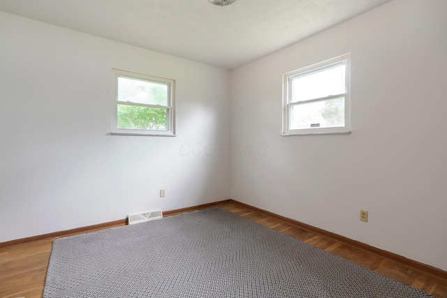 109 Williams Rd, Columbus, OH 43207 - spare room with baseboards and light wood-style flooring