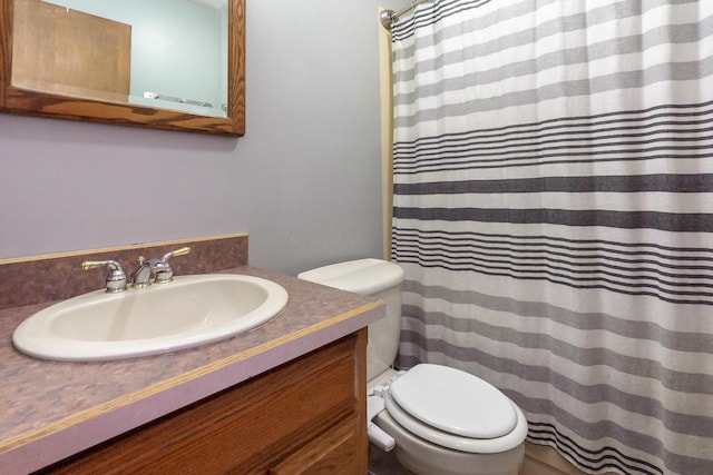 109 Williams Rd, Columbus, OH 43207 - bathroom featuring vanity, toilet, and a shower with shower curtain