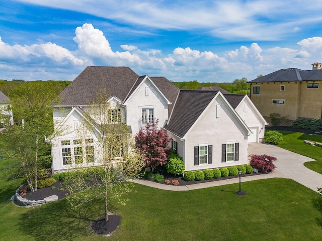 1393 Kearney Way, Delaware, OH 43015 - french country inspired facade featuring driveway, stucco siding, a front yard, and a garage