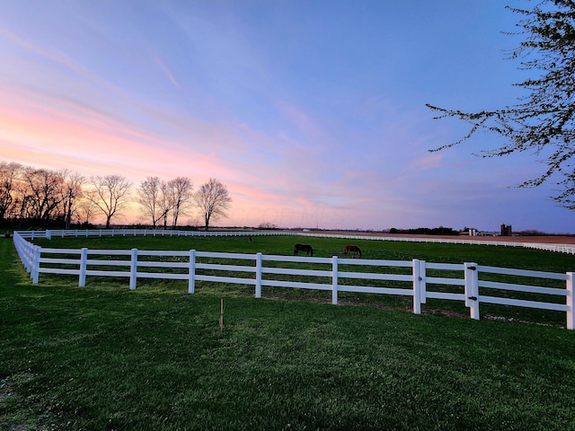 view of yard featuring a rural view and fence
