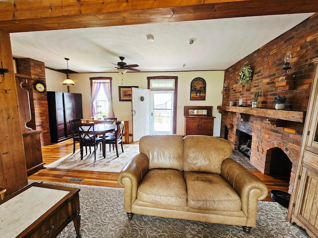 3851 Snow Hill Rd SW, Washington Court House, OH 43160 - living room with wood finished floors, ceiling fan, and a fireplace