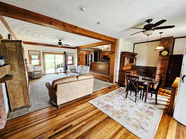 3851 Snow Hill Rd SW, Washington Court House, OH 43160 - living room with ceiling fan, hardwood / wood-style flooring, and crown molding