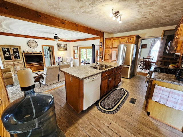 3851 Snow Hill Rd SW, Washington Court House, OH 43160 - kitchen with appliances with stainless steel finishes, a sink, wood-type flooring, beamed ceiling, and open floor plan