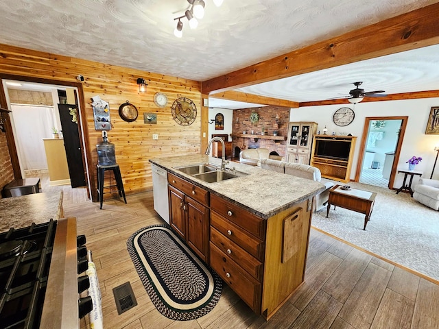 3851 Snow Hill Rd SW, Washington Court House, OH 43160 - kitchen featuring a sink, light wood finished floors, open floor plan, dishwasher, and beam ceiling
