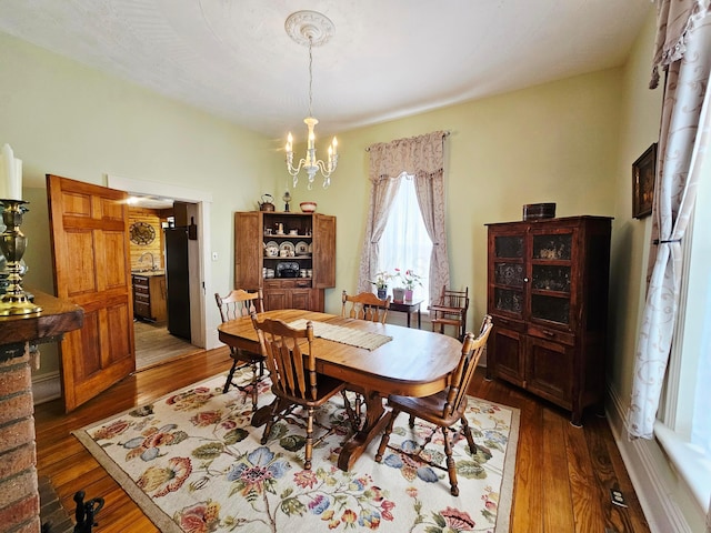 3851 Snow Hill Rd SW, Washington Court House, OH 43160 - dining area featuring a chandelier and hardwood / wood-style flooring