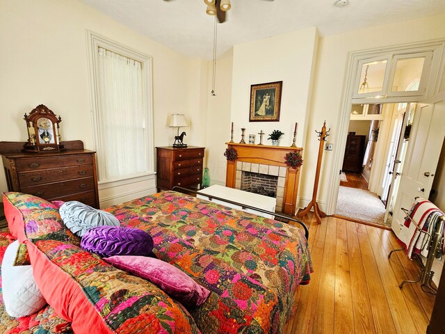3851 Snow Hill Rd SW, Washington Court House, OH 43160 - bedroom with wood-type flooring and a tiled fireplace