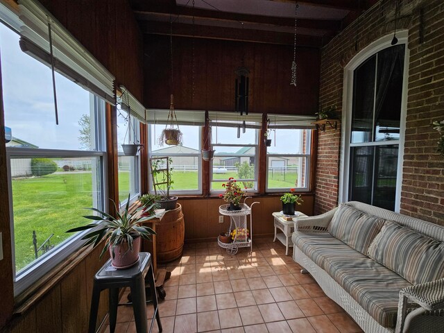 3851 Snow Hill Rd SW, Washington Court House, OH 43160 - sunroom / solarium featuring brick wall, tile patterned flooring, an outdoor hangout area, and beamed ceiling