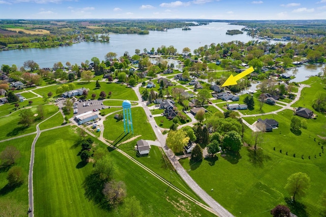 bird's eye view with a water view and a residential view