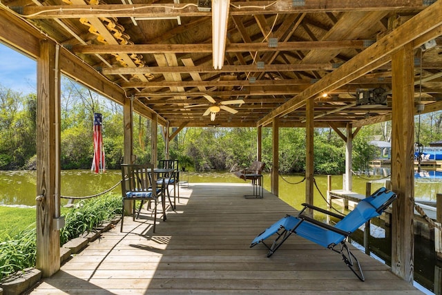 wooden deck featuring ceiling fan