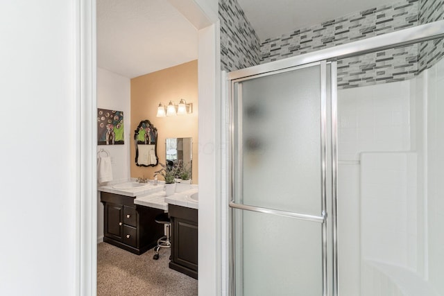 full bathroom with vanity and a stall shower