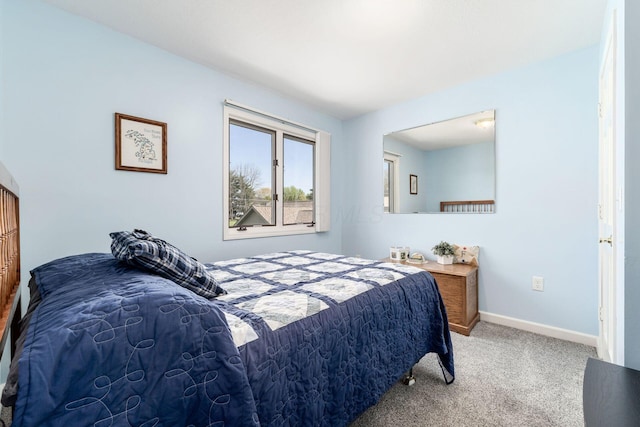 bedroom featuring carpet floors and baseboards