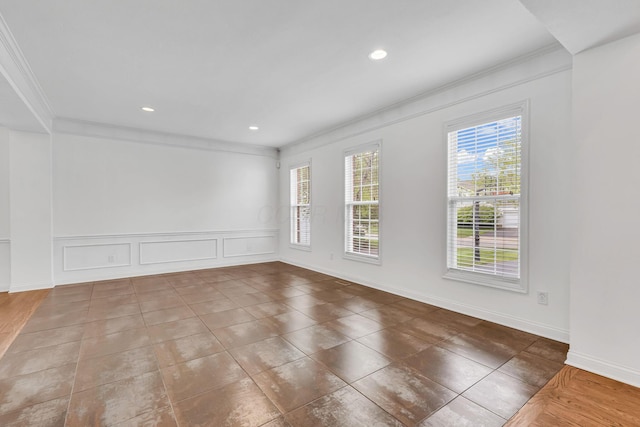 7169 Fernridge Dr, New Albany, OH 43054 - unfurnished room with crown molding, recessed lighting, a decorative wall, wainscoting, and baseboards