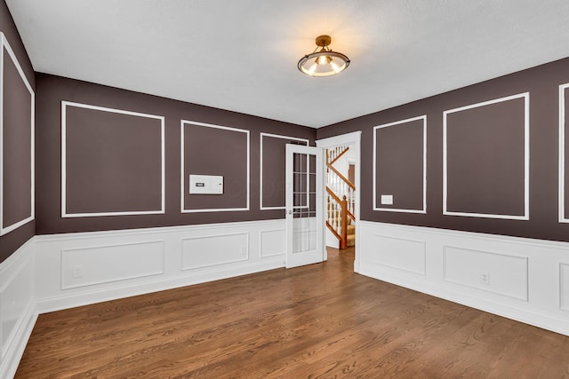 7169 Fernridge Dr, New Albany, OH 43054 - unfurnished room with a decorative wall and wood finished floors