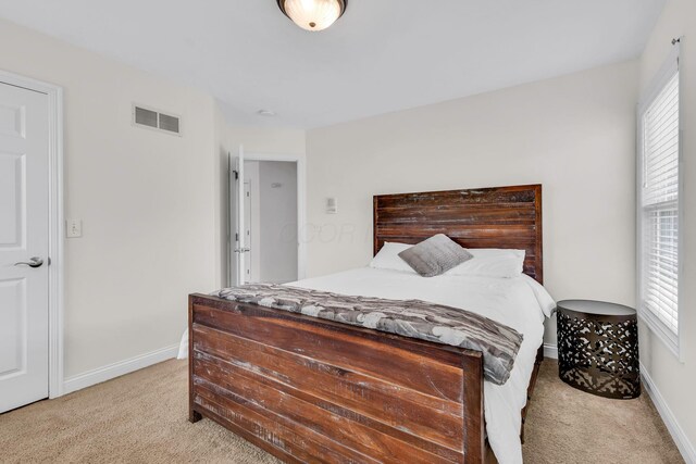 7169 Fernridge Dr, New Albany, OH 43054 - bedroom featuring light colored carpet and baseboards