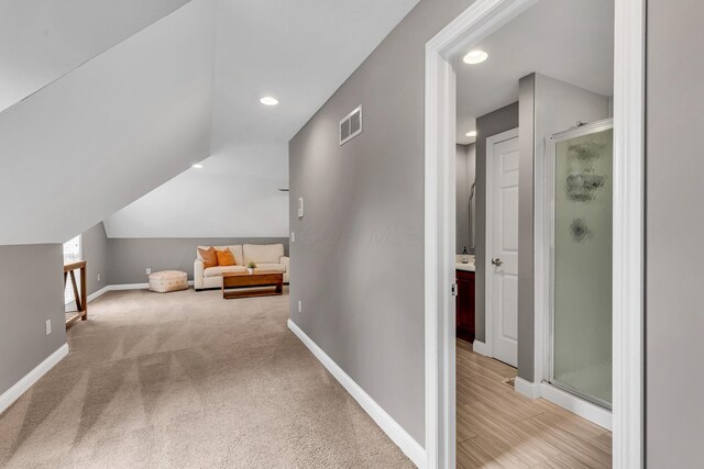 7169 Fernridge Dr, New Albany, OH 43054 - hall with recessed lighting, baseboards, lofted ceiling, and carpet