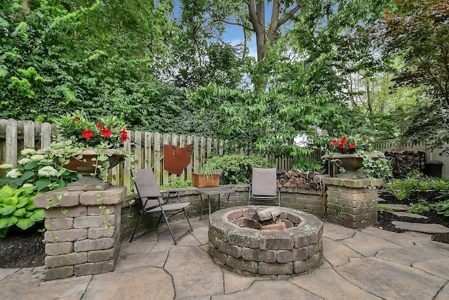 1799 Baldridge Rd, Columbus, OH 43221 - view of patio featuring a fire pit and fence