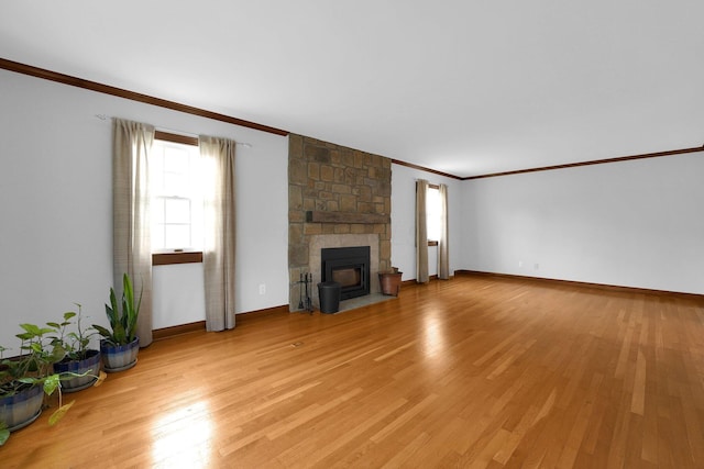 1799 Baldridge Rd, Columbus, OH 43221 - unfurnished living room featuring ornamental molding, light wood finished floors, a fireplace, and baseboards