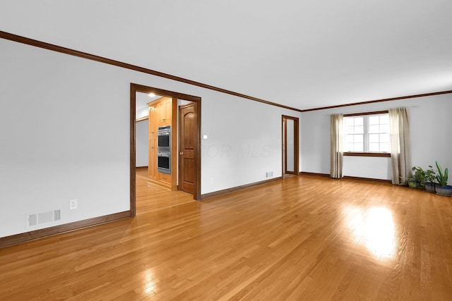1799 Baldridge Rd, Columbus, OH 43221 - spare room with ornamental molding, light wood-style floors, and baseboards
