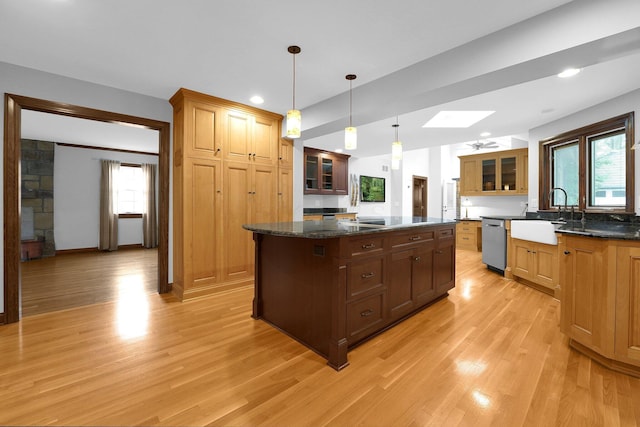 1799 Baldridge Rd, Columbus, OH 43221 - kitchen featuring a sink, stainless steel dishwasher, light wood finished floors, a kitchen island, and recessed lighting
