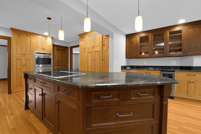 1799 Baldridge Rd, Columbus, OH 43221 - kitchen featuring black electric cooktop, light wood-type flooring, a center island, glass insert cabinets, and beverage cooler