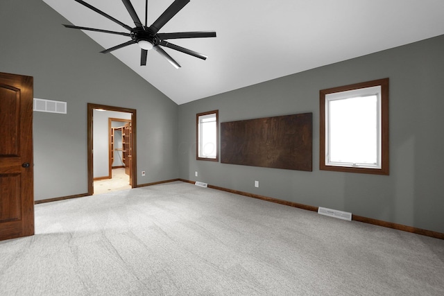 1799 Baldridge Rd, Columbus, OH 43221 - spare room with light carpet, baseboards, ceiling fan, and high vaulted ceiling