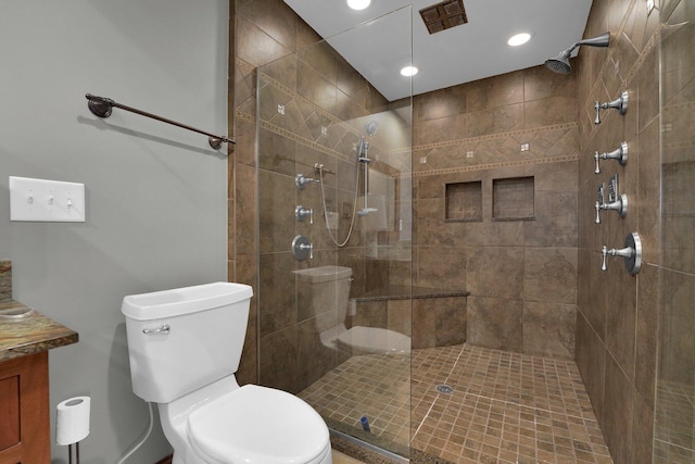 1799 Baldridge Rd, Columbus, OH 43221 - full bathroom with a tile shower, toilet, recessed lighting, and vanity