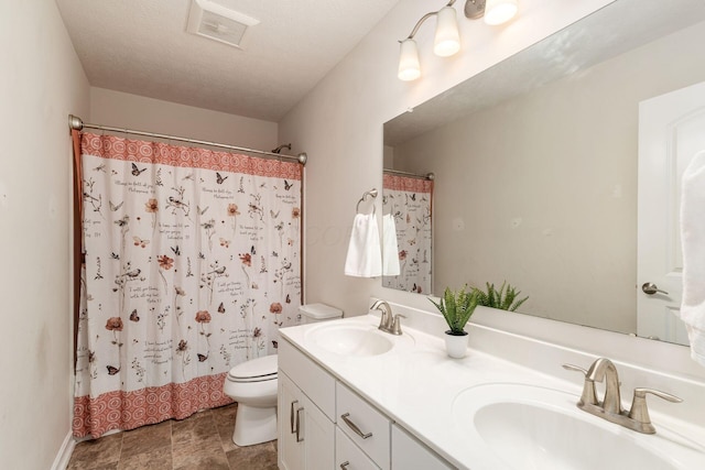 full bathroom with toilet, double vanity, and curtained shower