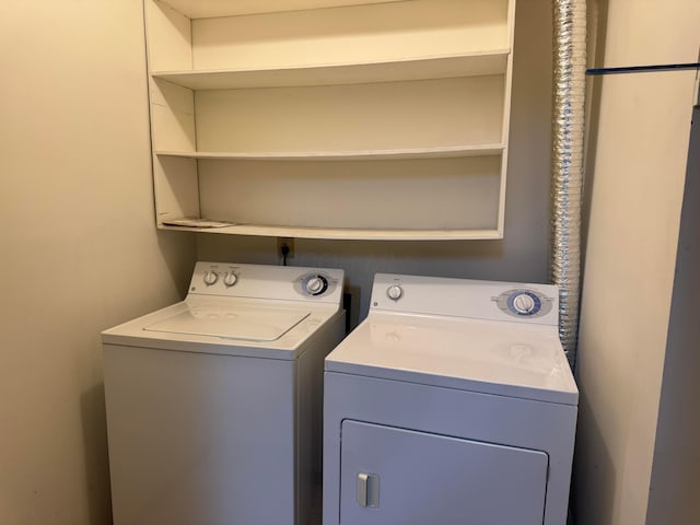 clothes washing area with laundry area and washing machine and dryer