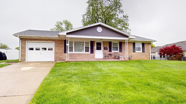 ranch-style house with an attached garage, a front lawn, brick siding, covered porch, and driveway