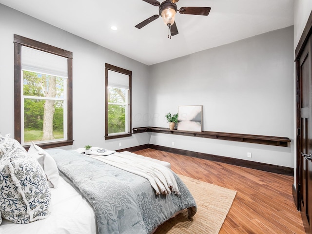 bedroom featuring recessed lighting, baseboards, and wood finished floors