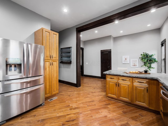 kitchen featuring stainless steel appliances, recessed lighting, and light wood-type flooring