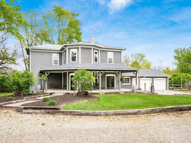 view of front of home featuring fence, an attached garage, a front lawn, a chimney, and driveway