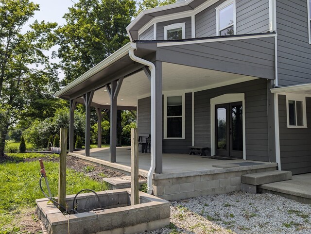 2310 Troy Rd, Delaware, OH 43015 - view of side of home featuring a porch and french doors