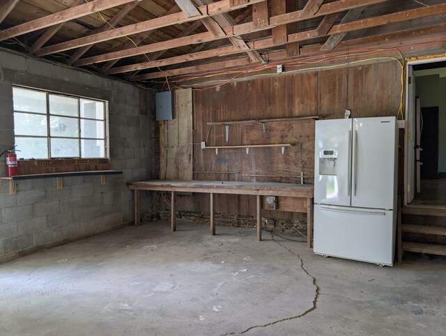 2310 Troy Rd, Delaware, OH 43015 - basement featuring white fridge with ice dispenser and concrete block wall
