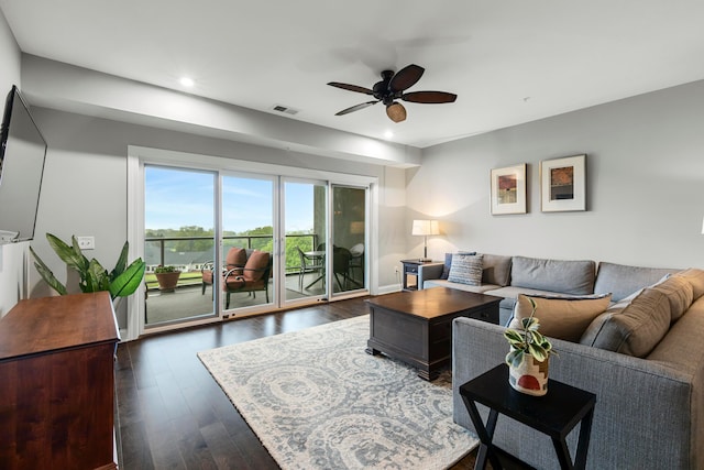 living room featuring ceiling fan, recessed lighting, visible vents, and dark wood-style flooring