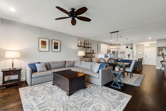 living room with a ceiling fan, baseboards, recessed lighting, and dark wood-type flooring