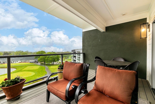 balcony featuring a water view