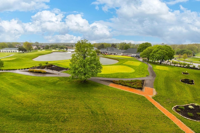 view of property's community with a water view and view of golf course