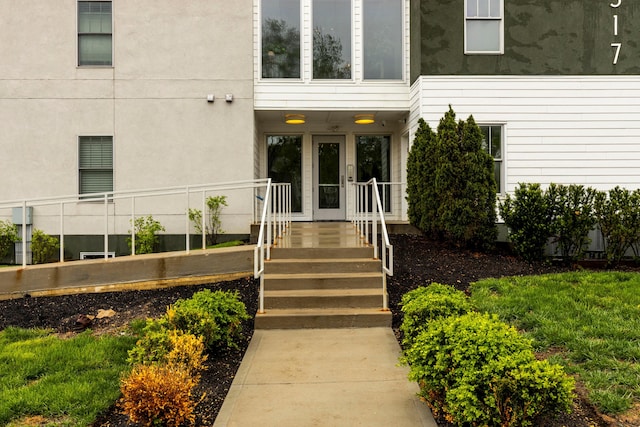 entrance to property with stucco siding