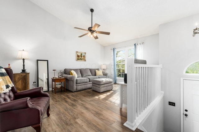 living area with a healthy amount of sunlight, ceiling fan, and wood finished floors