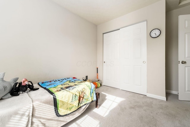 carpeted bedroom with baseboards