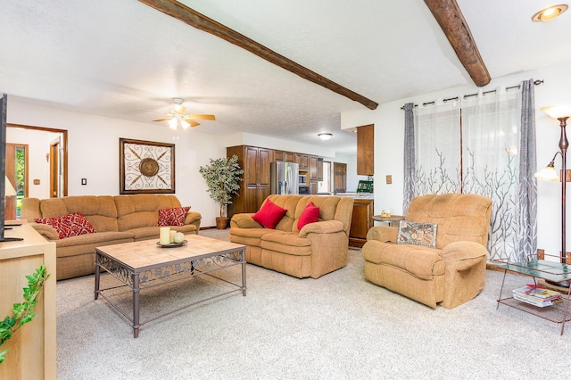 333 Salem Rd, Caledonia, OH 43314 - living area featuring beam ceiling, carpet flooring, and a ceiling fan
